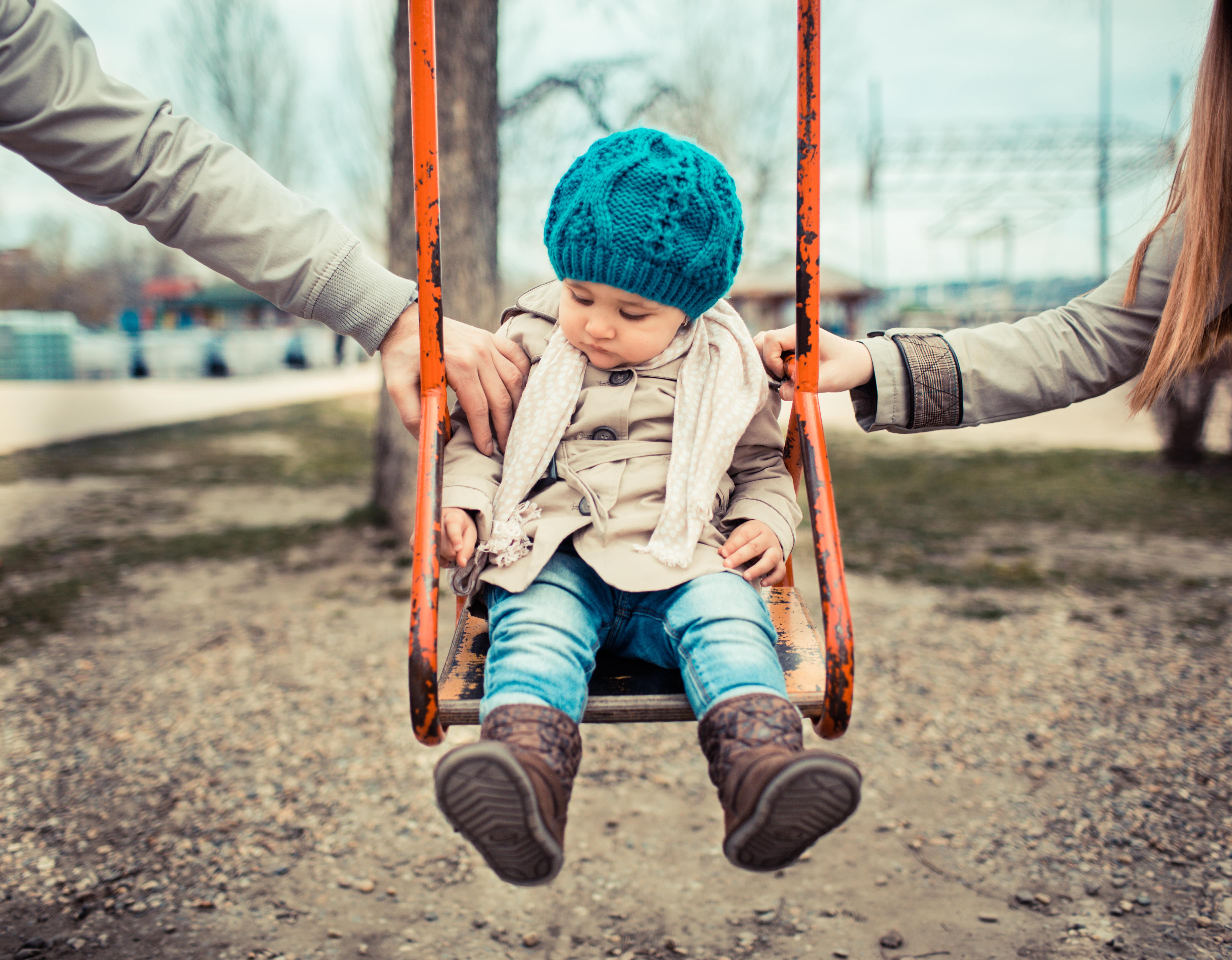 young girl on swing